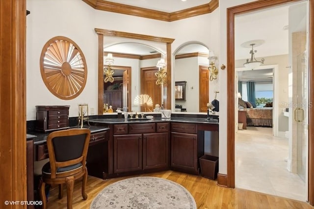 919 Ballinger Rd, Lutz, FL 33548 - bar area featuring crown molding and light wood-style flooring