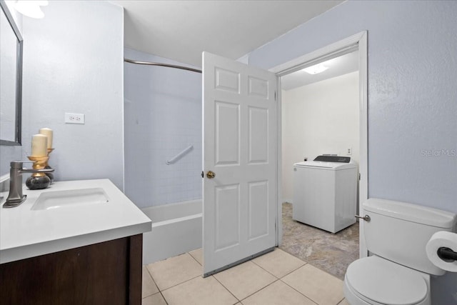 903 Tomahawk Trl, Brandon, FL 33511 - bathroom featuring washer / clothes dryer, toilet, vanity, bathing tub / shower combination, and tile patterned flooring