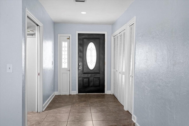 903 Tomahawk Trl, Brandon, FL 33511 - entryway with tile patterned floors and baseboards