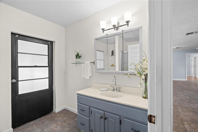 903 Tomahawk Trl, Brandon, FL 33511 - bathroom with vanity, baseboards, and tile patterned flooring
