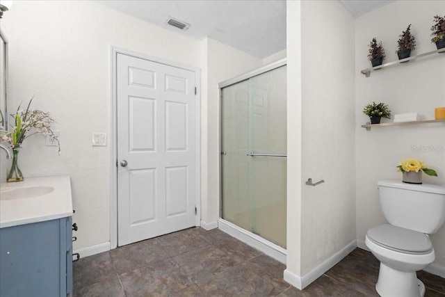 903 Tomahawk Trl, Brandon, FL 33511 - bathroom featuring vanity, a stall shower, baseboards, and toilet