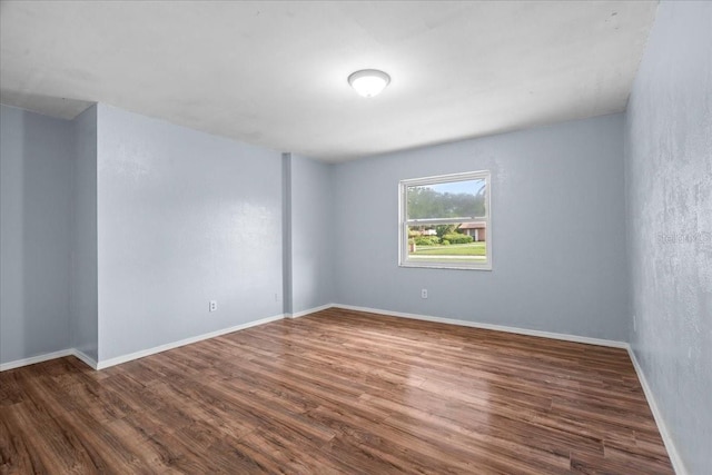 903 Tomahawk Trl, Brandon, FL 33511 - spare room featuring wood finished floors and baseboards