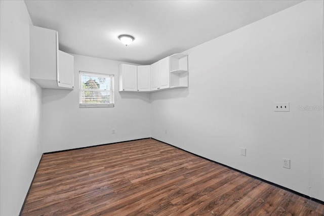 903 Tomahawk Trl, Brandon, FL 33511 - unfurnished room featuring dark wood-type flooring