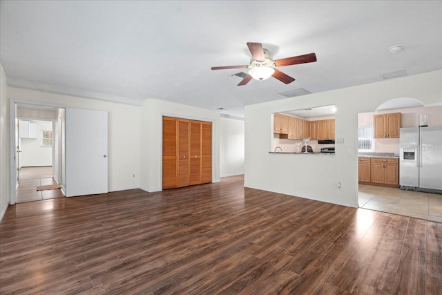 903 Tomahawk Trl, Brandon, FL 33511 - unfurnished living room with ceiling fan and wood finished floors
