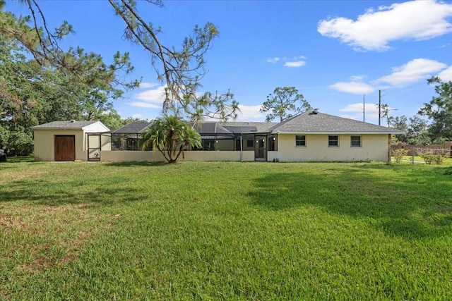 903 Tomahawk Trl, Brandon, FL 33511 - rear view of house with a lawn, a lanai, and stucco siding