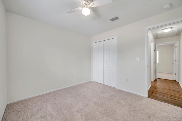 unfurnished bedroom featuring carpet flooring, baseboards, a closet, and a ceiling fan