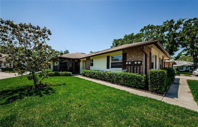 368 Perth Ct Unit 368, Dunedin, FL 34698 - ranch-style house with brick siding and a front yard