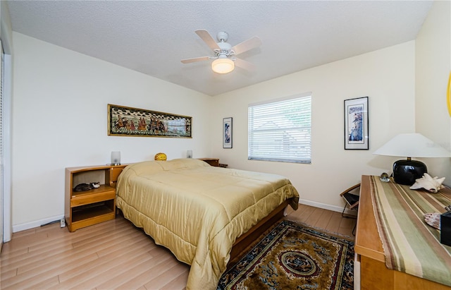 368 Perth Ct Unit 368, Dunedin, FL 34698 - bedroom featuring light wood finished floors, baseboards, and a ceiling fan