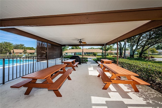368 Perth Ct Unit 368, Dunedin, FL 34698 - view of patio featuring ceiling fan, a grill, and a carport