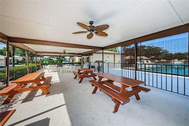 368 Perth Ct Unit 368, Dunedin, FL 34698 - view of patio with ceiling fan, outdoor dining space, and a community pool