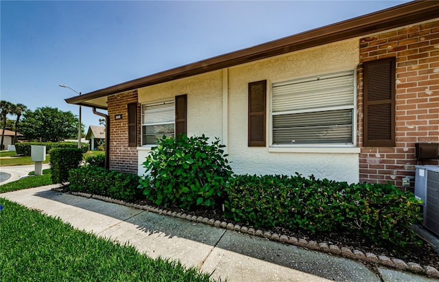 368 Perth Ct Unit 368, Dunedin, FL 34698 - view of side of property with brick siding and stucco siding