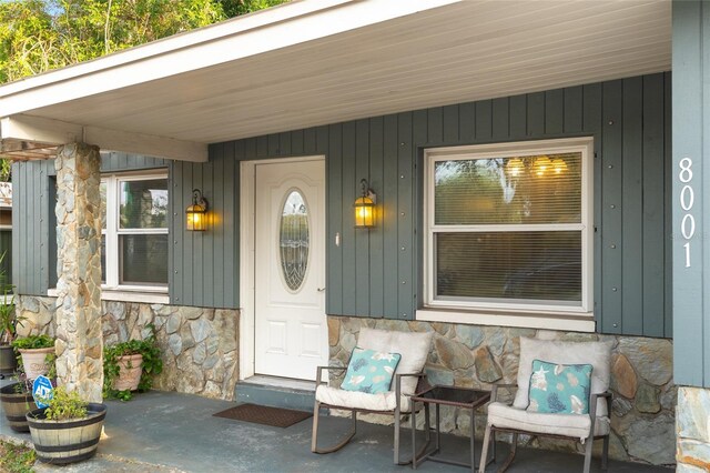 8001 N Ola Ave, Tampa, FL 33604 - entrance to property with stone siding and covered porch