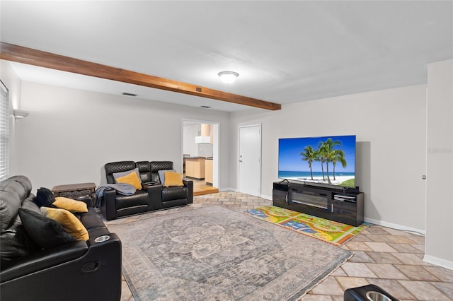 8001 N Ola Ave, Tampa, FL 33604 - living room featuring beamed ceiling, baseboards, and light stone finish flooring