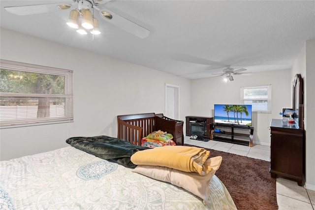 8001 N Ola Ave, Tampa, FL 33604 - bedroom featuring light tile patterned floors and a ceiling fan