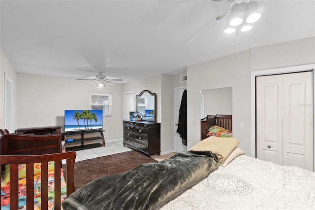 8001 N Ola Ave, Tampa, FL 33604 - bedroom with light tile patterned flooring, a closet, ceiling fan, and baseboards