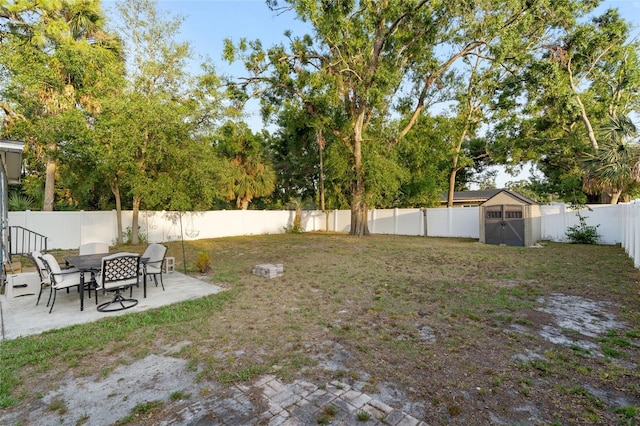 8001 N Ola Ave, Tampa, FL 33604 - fenced backyard featuring a patio, a shed, and an outdoor structure