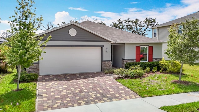 3891 Reflection Dock Dr, Seffner, FL 33584 - view of front facade featuring stone siding, decorative driveway, a garage, roof with shingles, and stucco siding