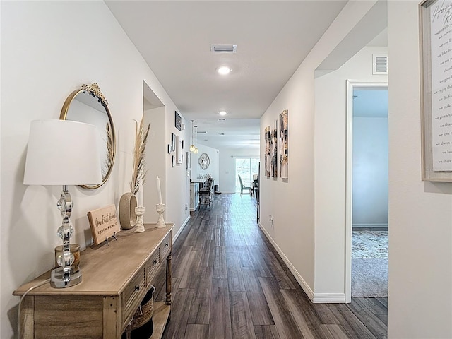 3891 Reflection Dock Dr, Seffner, FL 33584 - hallway featuring dark wood-type flooring, baseboards, and recessed lighting