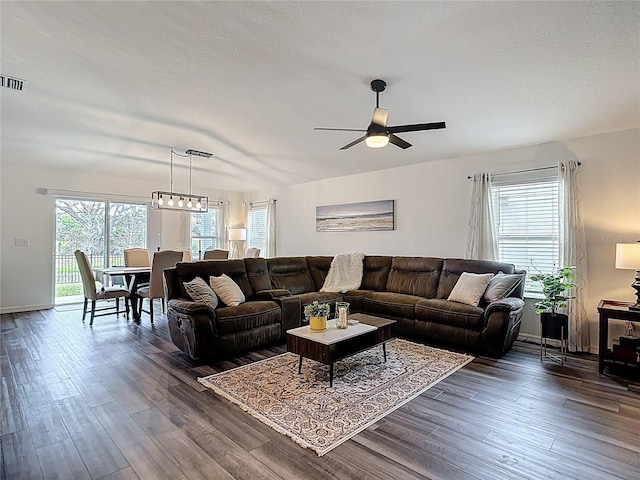 3891 Reflection Dock Dr, Seffner, FL 33584 - living area featuring ceiling fan and dark wood-style floors