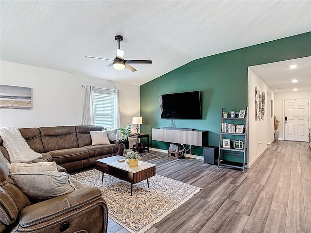 3891 Reflection Dock Dr, Seffner, FL 33584 - living room featuring wood finished floors, a ceiling fan, baseboards, vaulted ceiling, and recessed lighting