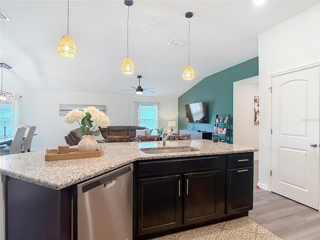 3891 Reflection Dock Dr, Seffner, FL 33584 - kitchen featuring dishwasher, a sink, light wood finished floors, ceiling fan, and open floor plan