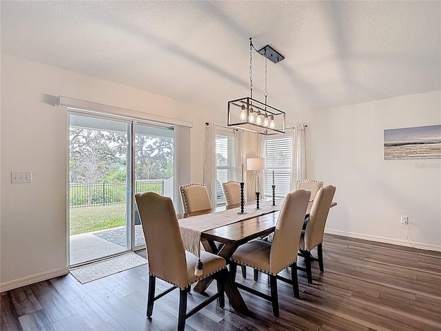 3891 Reflection Dock Dr, Seffner, FL 33584 - dining space featuring dark wood finished floors, baseboards, and a chandelier