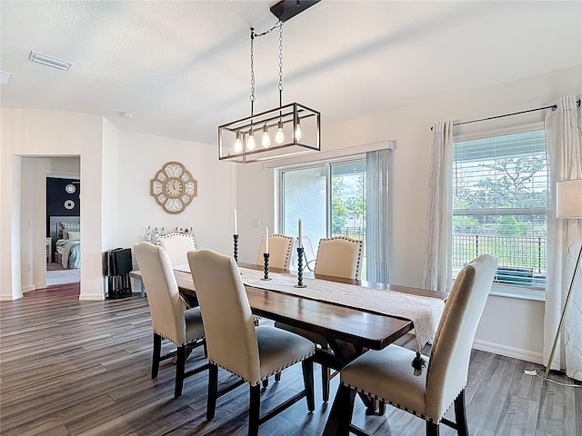 3891 Reflection Dock Dr, Seffner, FL 33584 - dining room with dark wood-style floors and baseboards