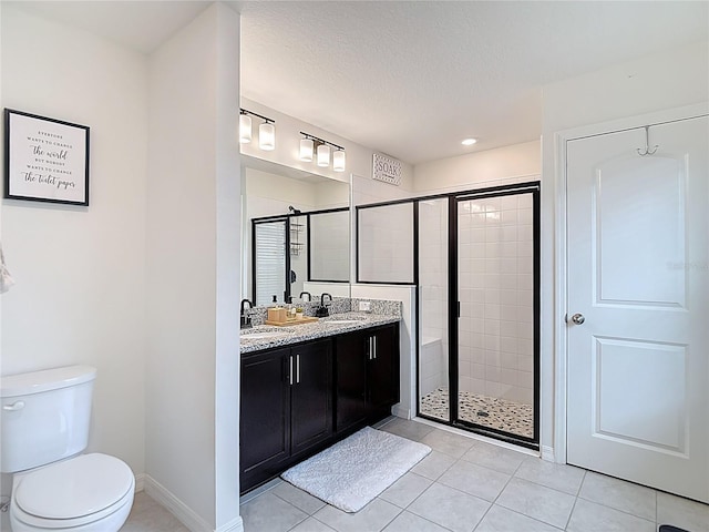 3891 Reflection Dock Dr, Seffner, FL 33584 - full bath featuring a shower stall, tile patterned floors, toilet, double vanity, and baseboards