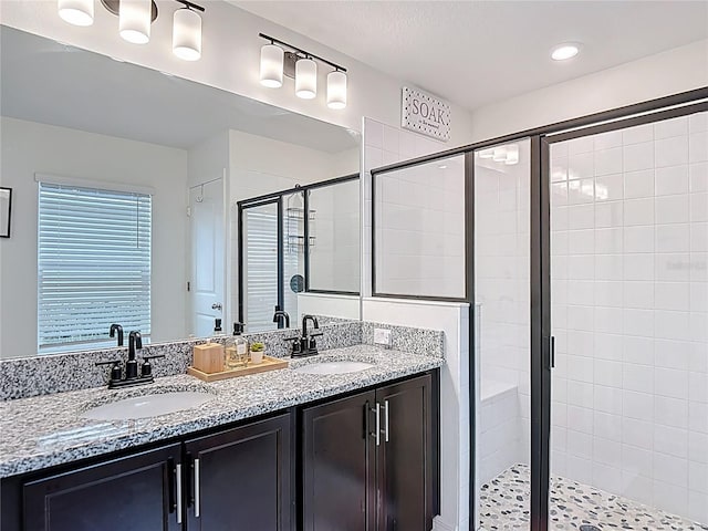 3891 Reflection Dock Dr, Seffner, FL 33584 - bathroom with a stall shower, double vanity, and recessed lighting