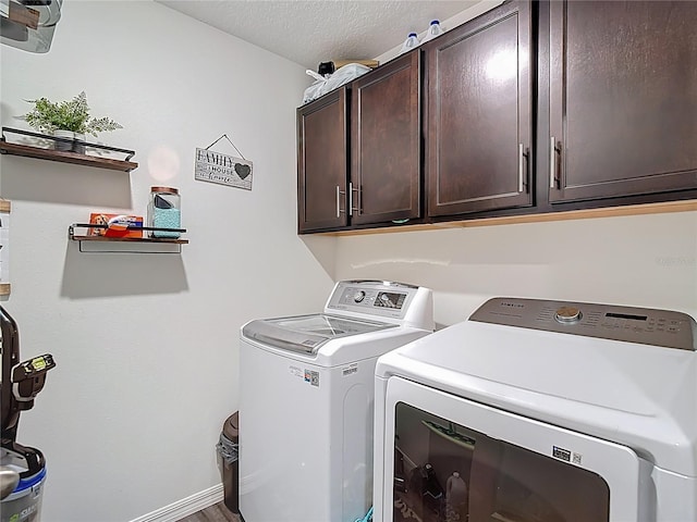 3891 Reflection Dock Dr, Seffner, FL 33584 - laundry room with cabinet space, washer and dryer, and a textured ceiling