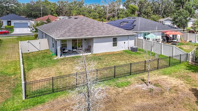 3891 Reflection Dock Dr, Seffner, FL 33584 - back of house with a gate, a shingled roof, cooling unit, stucco siding, and a patio area