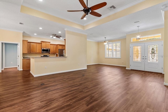 unfurnished living room featuring ceiling fan, dark wood-style floors, ornamental molding, baseboards, and recessed lighting