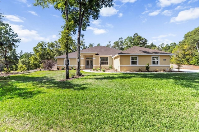 single story home with stucco siding and a front lawn