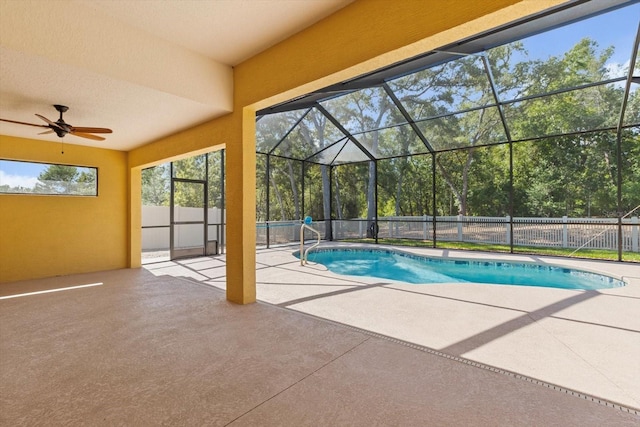 view of swimming pool featuring a patio, ceiling fan, and a fenced backyard
