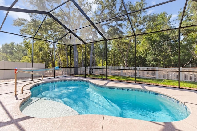 view of swimming pool with a fenced backyard and a patio