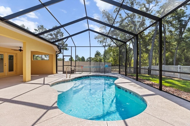 view of pool with a patio, a fenced backyard, french doors, and ceiling fan