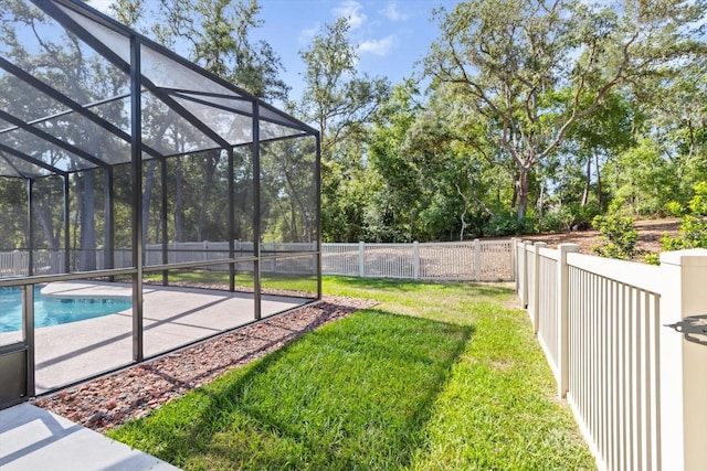view of swimming pool featuring a patio area and glass enclosure