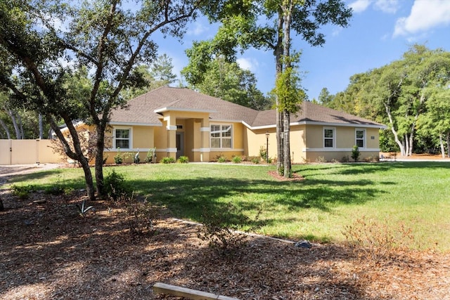 ranch-style house with stucco siding and a shingled roof