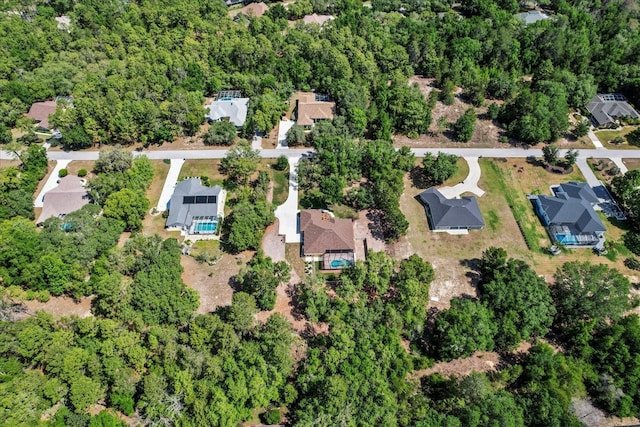aerial view of property and surrounding area with nearby suburban area