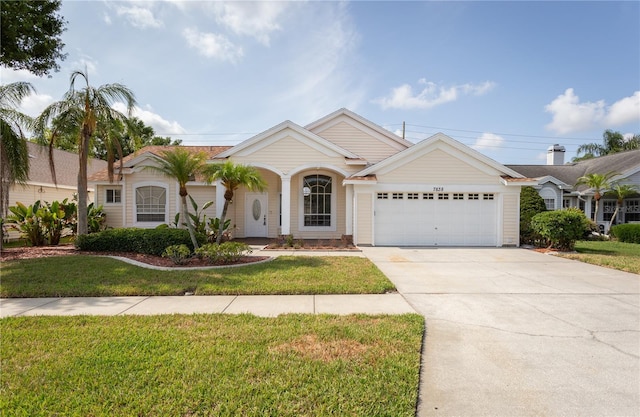 7838 Trail Run Loop, New Port Richey, FL 34653 - ranch-style house featuring an attached garage, concrete driveway, and a front yard