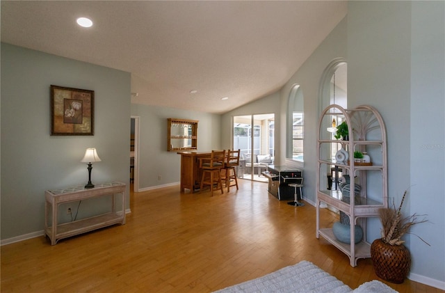7838 Trail Run Loop, New Port Richey, FL 34653 - living room featuring wood finished floors, baseboards, and recessed lighting