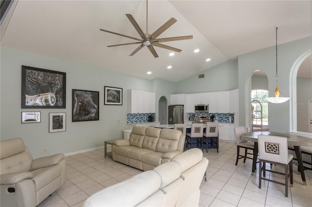 7838 Trail Run Loop, New Port Richey, FL 34653 - living room featuring arched walkways, ceiling fan, light tile patterned floors, recessed lighting, and high vaulted ceiling