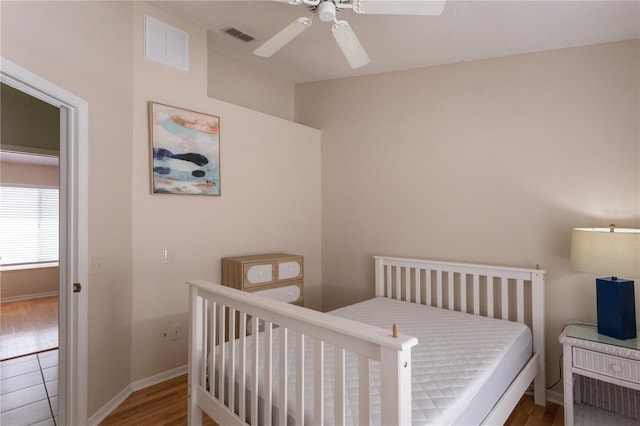 7838 Trail Run Loop, New Port Richey, FL 34653 - bedroom featuring baseboards, a ceiling fan, wood finished floors, and lofted ceiling