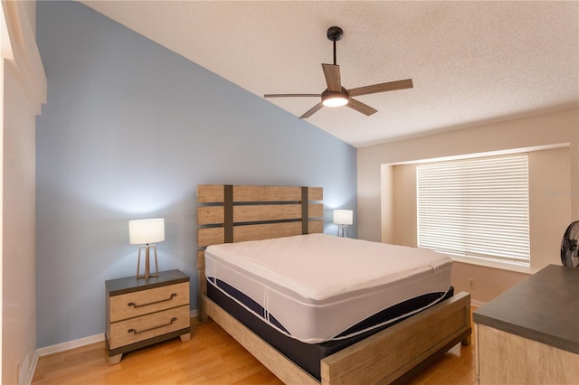 7838 Trail Run Loop, New Port Richey, FL 34653 - bedroom featuring vaulted ceiling, light wood-style flooring, baseboards, and a ceiling fan