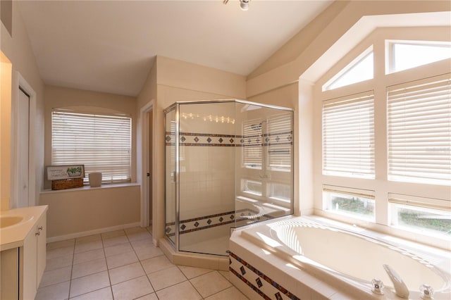 7838 Trail Run Loop, New Port Richey, FL 34653 - bathroom featuring a stall shower, a bath, tile patterned flooring, vanity, and vaulted ceiling