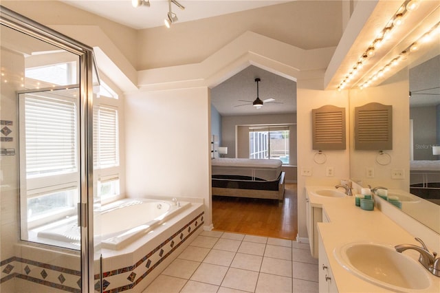 7838 Trail Run Loop, New Port Richey, FL 34653 - full bathroom with ensuite bath, tile patterned flooring, double vanity, a garden tub, and ceiling fan