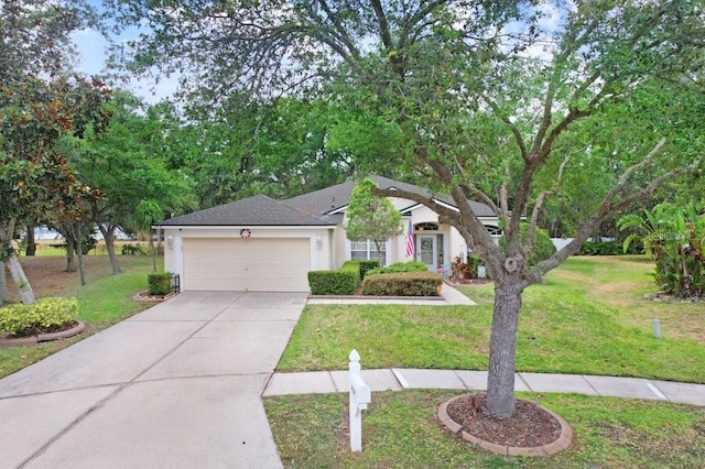 view of property hidden behind natural elements featuring an attached garage, stucco siding, driveway, and a front yard