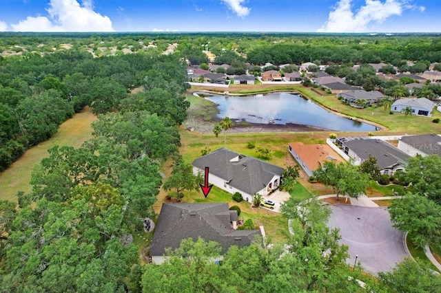 aerial view of property's location with nearby suburban area and a nearby body of water