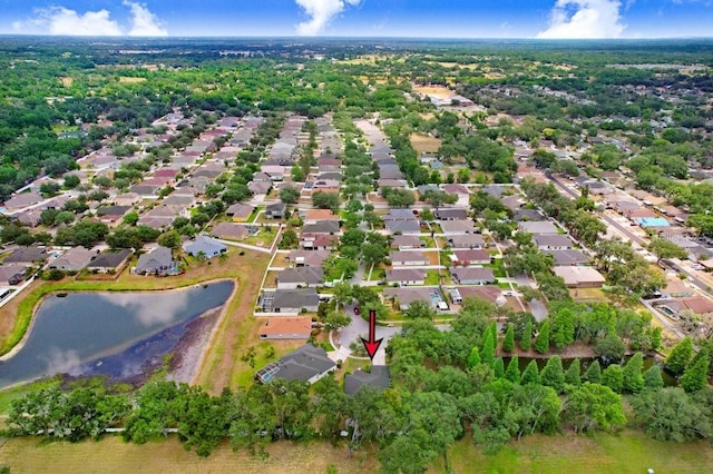 view of property location with nearby suburban area and a nearby body of water