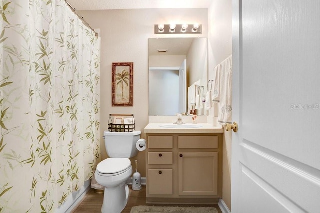 full bathroom with toilet, vanity, a shower with curtain, and wood finished floors